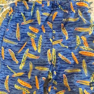Little boy swim trunks with pockets on sides and 1 in back 1 inside